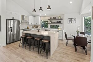 Elegant Open-Concept Kitchen with Dining Space and Outdoor Views